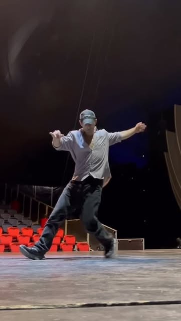 Orkhan dancing on a theater stage
